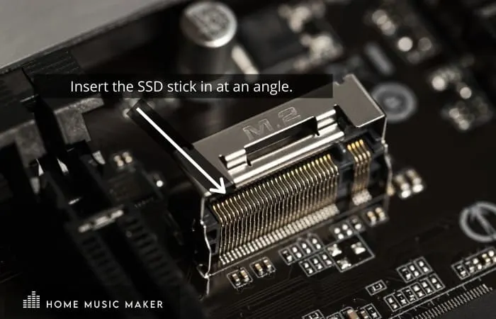 Insert the SSD stick in at an angle. 