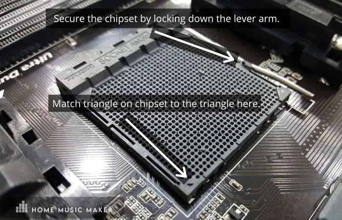 Secure the chipset by locking down the lever arm. 