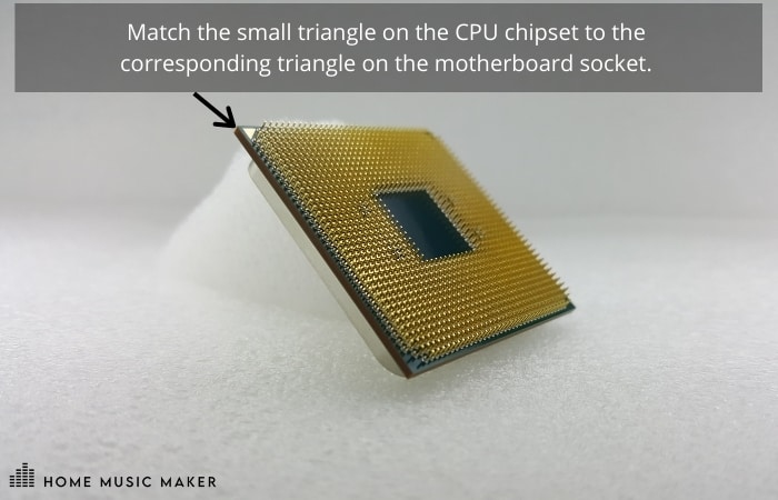 Match the small triangle on the CPU chipset to the 
corresponding triangle on the motherboard socket. 