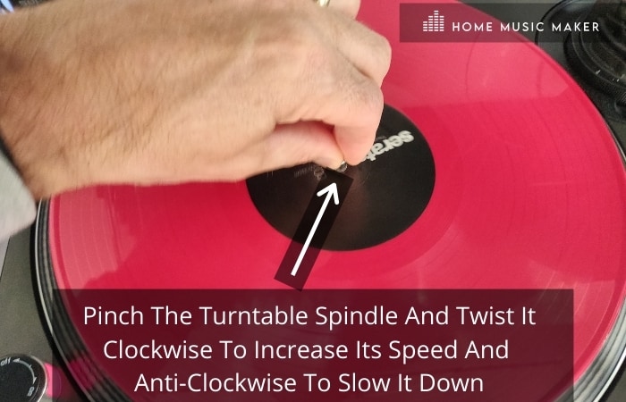 Get in the mix - pinch the turntable spindle and twist it clockwise to increase its speed and anti-clockwise to slow it down.