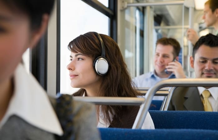You can do a nice exercise while commuting to guess the chords being played on the radio, write it down, and check afterward either with an instrument or sheet music. There's a big chance you'll be wrong more often than not, but if you do it daily, you'll be surprised at how quickly your aural skills will improve. 