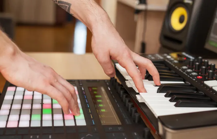 Man Using Ableton Push And MIDI Keyboard