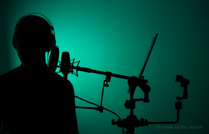 Silhouette Of A Man Recording Vocals