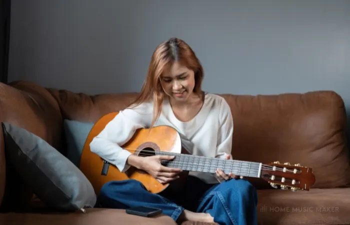 Woman Playing Acoustic Guitar