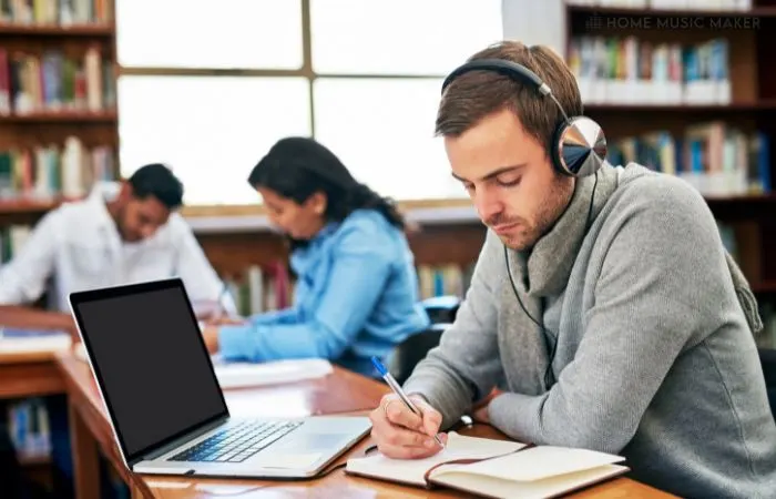 Man Studying With Headphones On