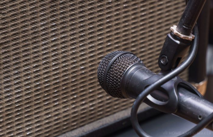 Photo Of Microphone Up To An Amp